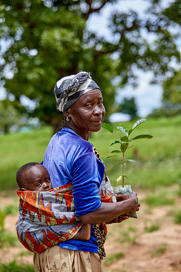 baby holding tree sapling Grow Hope projectc Navio
